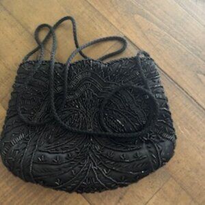 Black small clutch -shoulder length strap -great for  makeup or cell phone